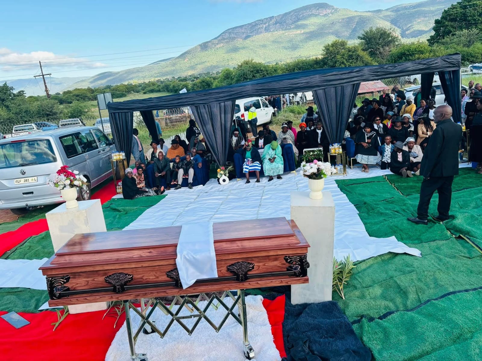 Mamutsha funeral setup with casket and decorated tent